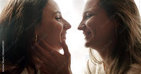 lesbian touching each other|Authentic LGBT female lesbian couple kissing each other in slow。